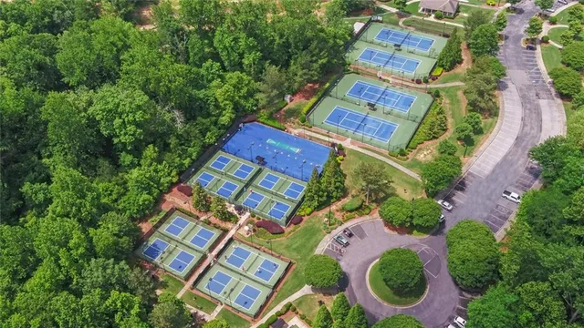 a aerial view of a house with a garden and a trees