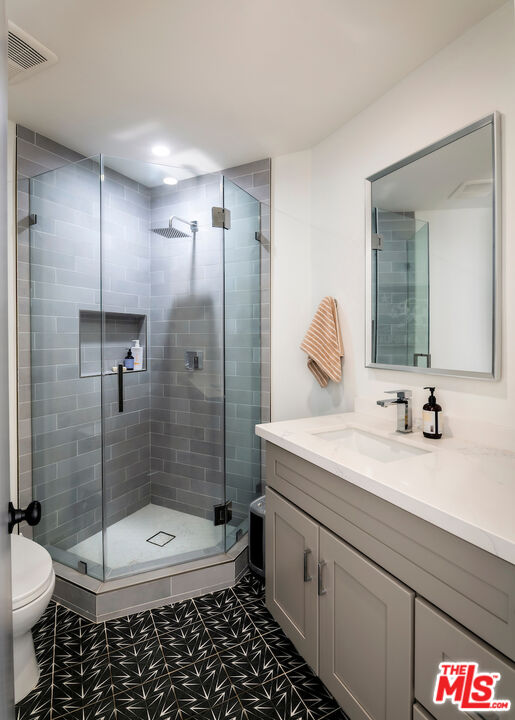 17003 Rancho Street Encino, CA 91316 - Photo 17 of 29 a bathroom with a sink a toilet and shower