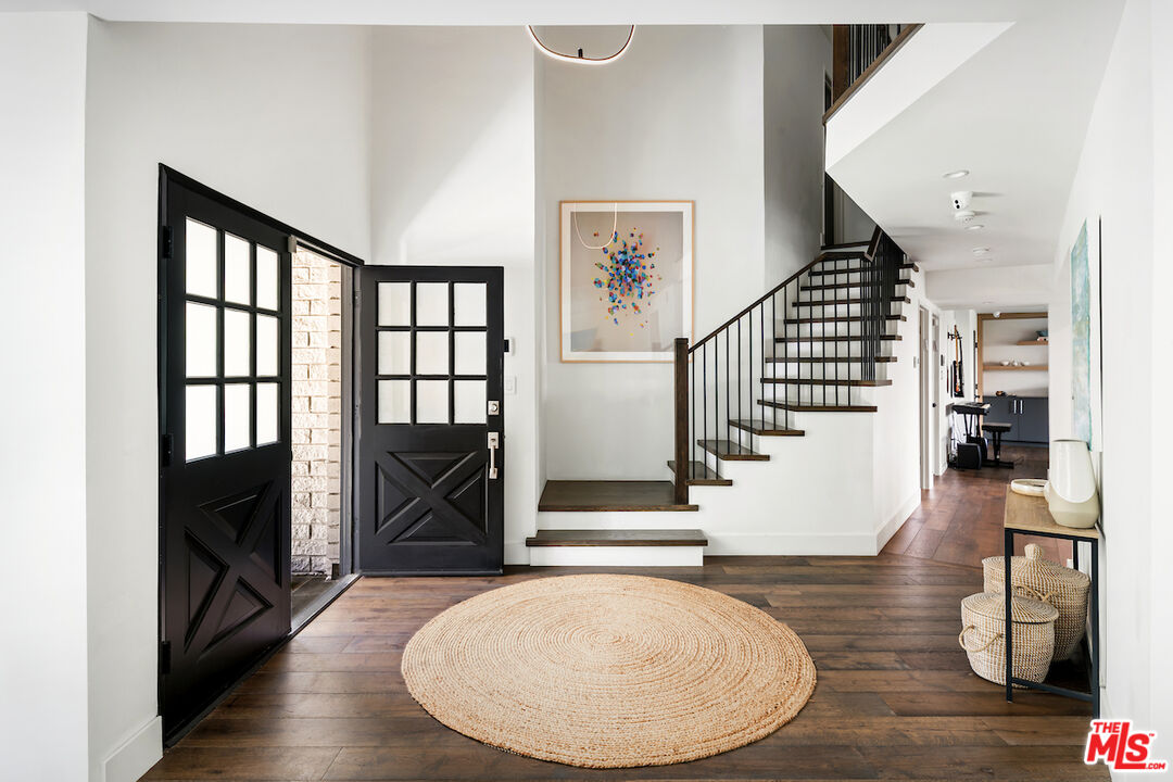 17003 Rancho Street Encino, CA 91316 - Photo 18 of 29 a view of entryway and hall with wooden floor