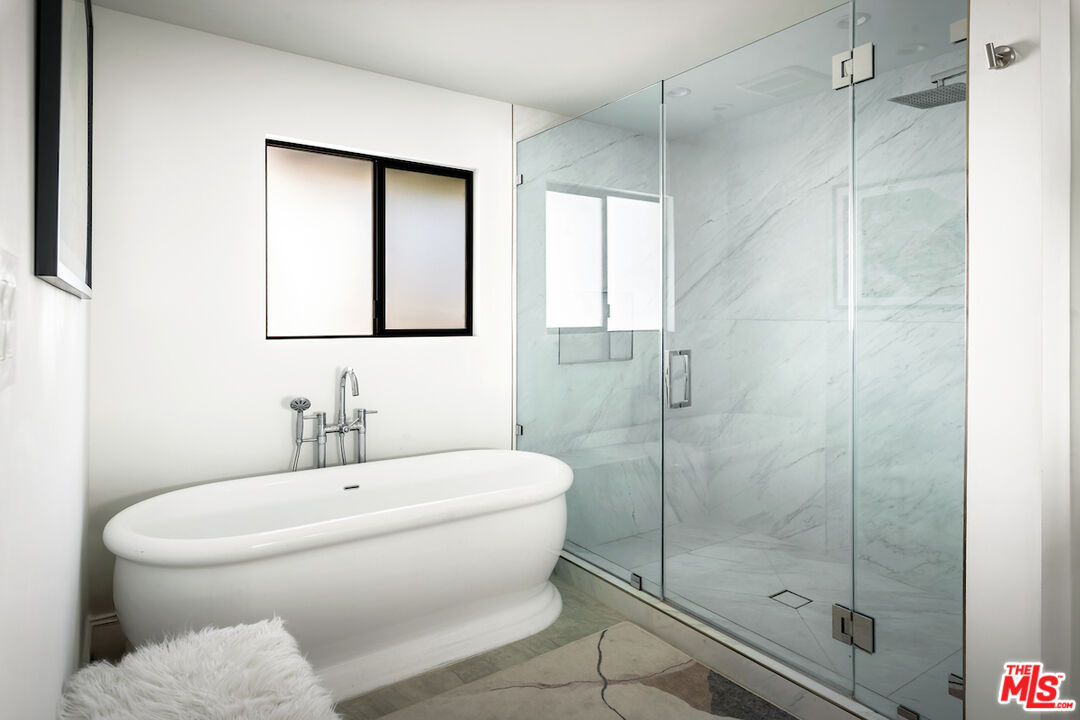 17003 Rancho Street Encino, CA 91316 - Photo 21 of 29 a bathroom with a toilet sink and shower