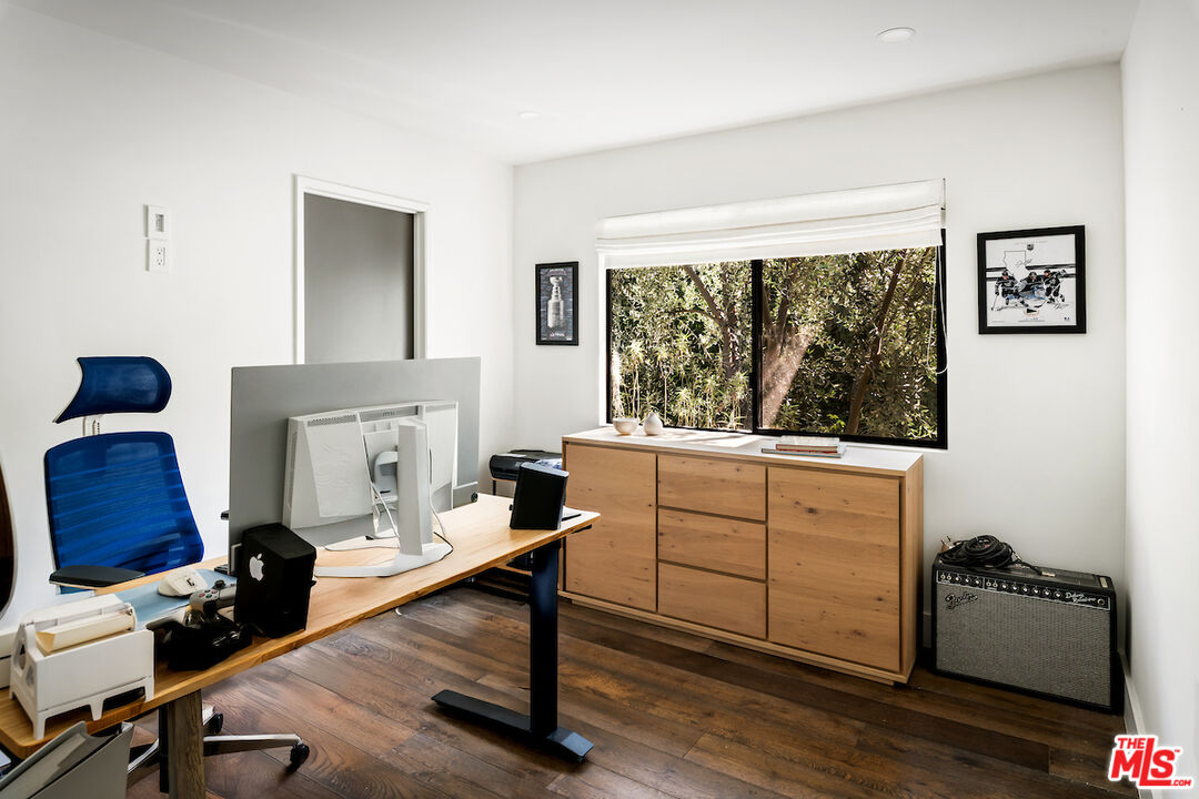 17003 Rancho Street Encino, CA 91316 - Photo 25 of 29 a room with furniture and a window
