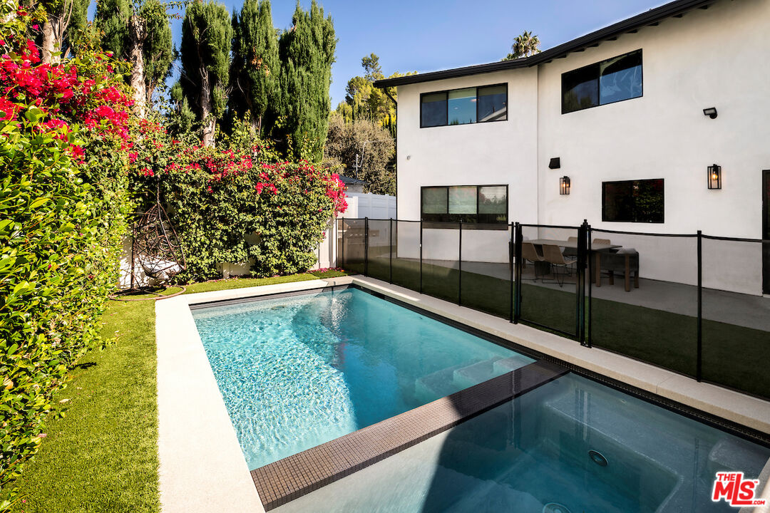 17003 Rancho Street Encino, CA 91316 - Photo 28 of 29 a view of swimming pool with a patio