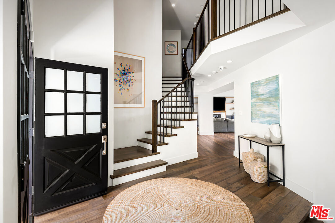 17003 Rancho Street Encino, CA 91316 - Photo 5 of 29 a view of entryway and hall with wooden floor