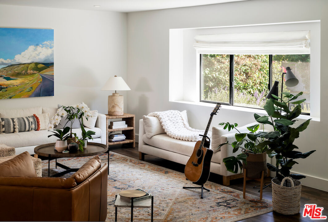 17003 Rancho Street Encino, CA 91316 - Photo 6 of 29 a living room with furniture and a potted plant