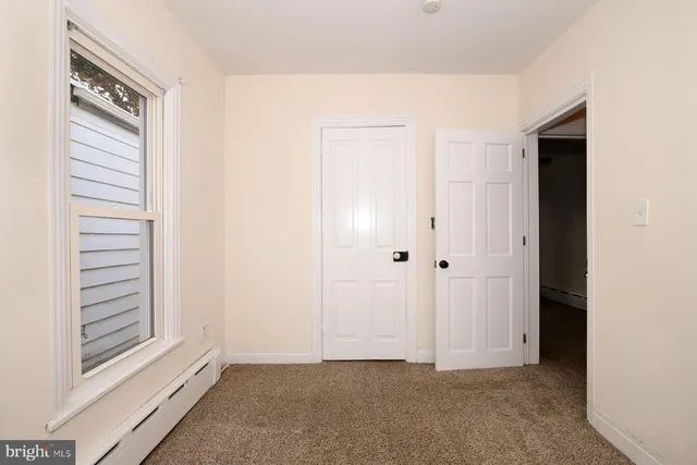 a view of an empty room and window