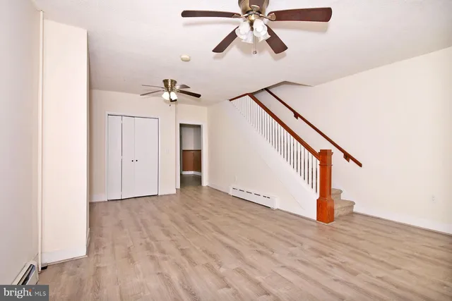 a view of an entryway with wooden floor
