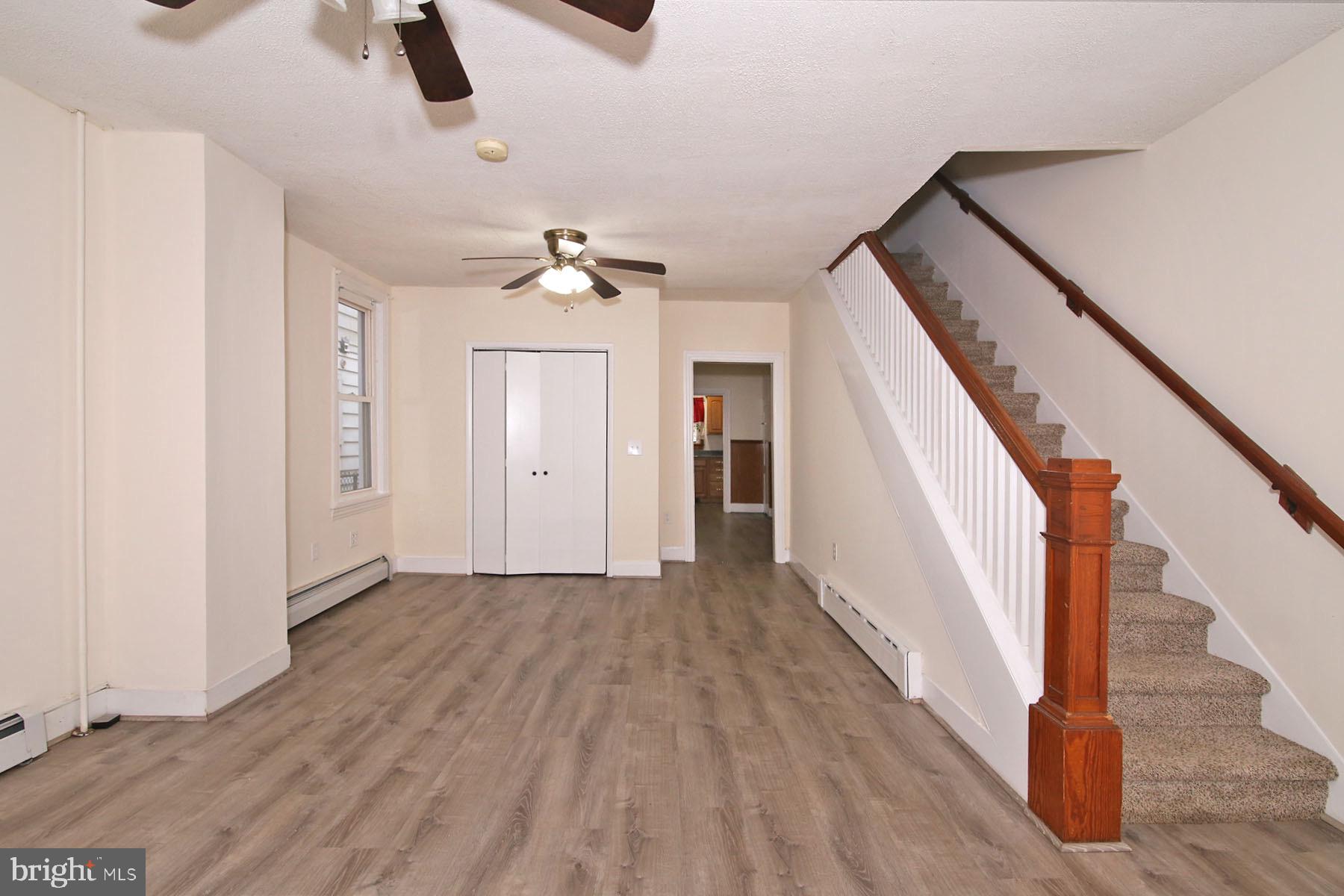 132 Mifflin Street Lebanon, PA 17046 - Photo 4 of 22 wooden floor in an empty room with a window