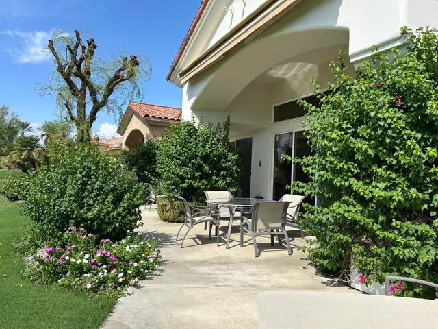 a view of swimming pool with outdoor seating
