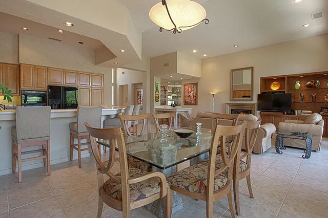 a kitchen with stainless steel appliances a refrigerator sink and cabinets