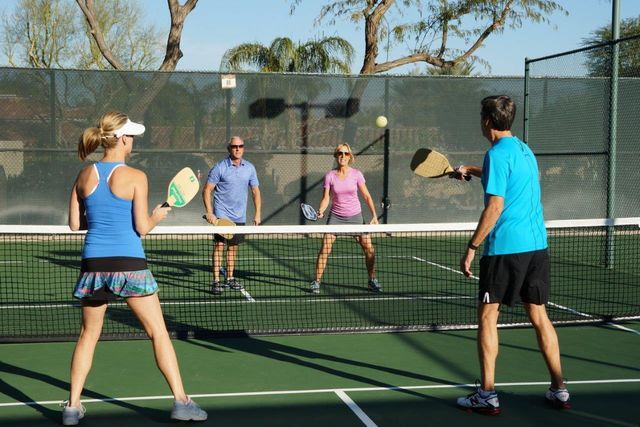a living room with lots of furniture and a large window