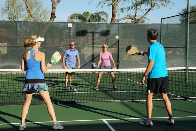a living room with lots of furniture and a large window