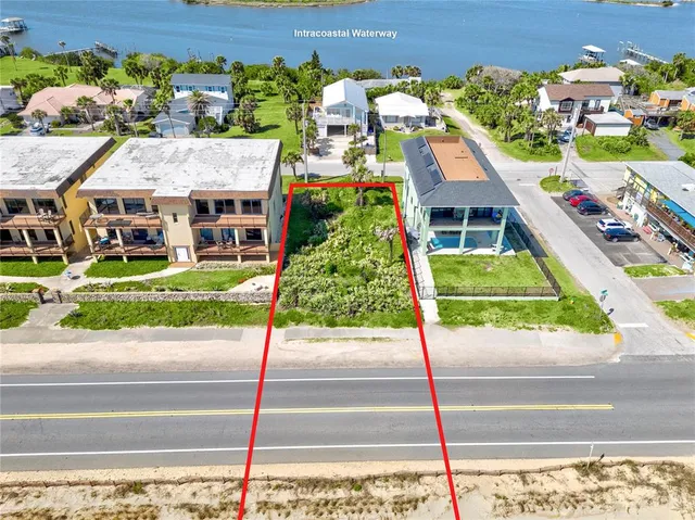 a aerial view of a house with a garden and plants