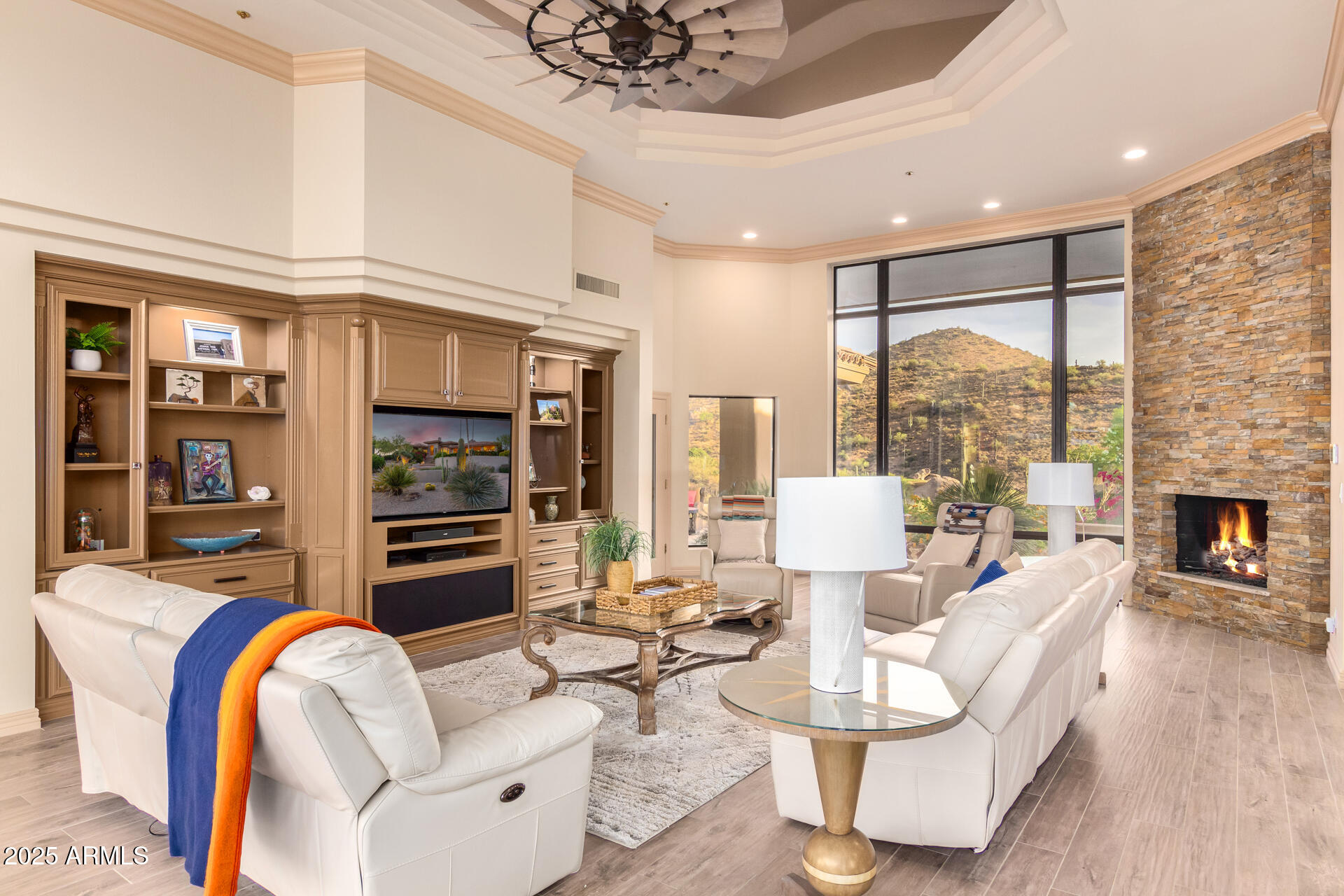 10801 East Happy Valley Road, Unit 133 Scottsdale, AZ 85255 - Photo 11 of 75 a living room with fireplace furniture and a floor to ceiling window