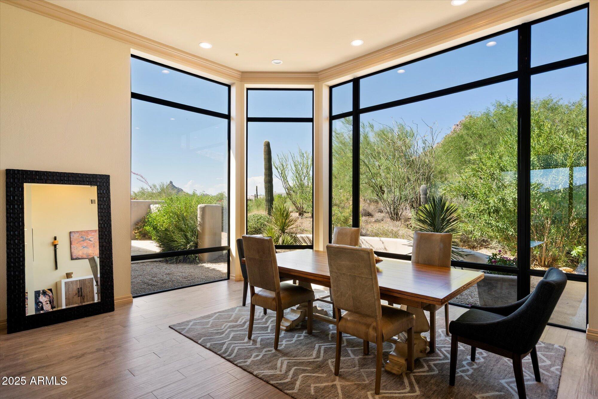 10801 East Happy Valley Road, Unit 133 Scottsdale, AZ 85255 - Photo 13 of 75 a dining room with furniture and a floor to ceiling window