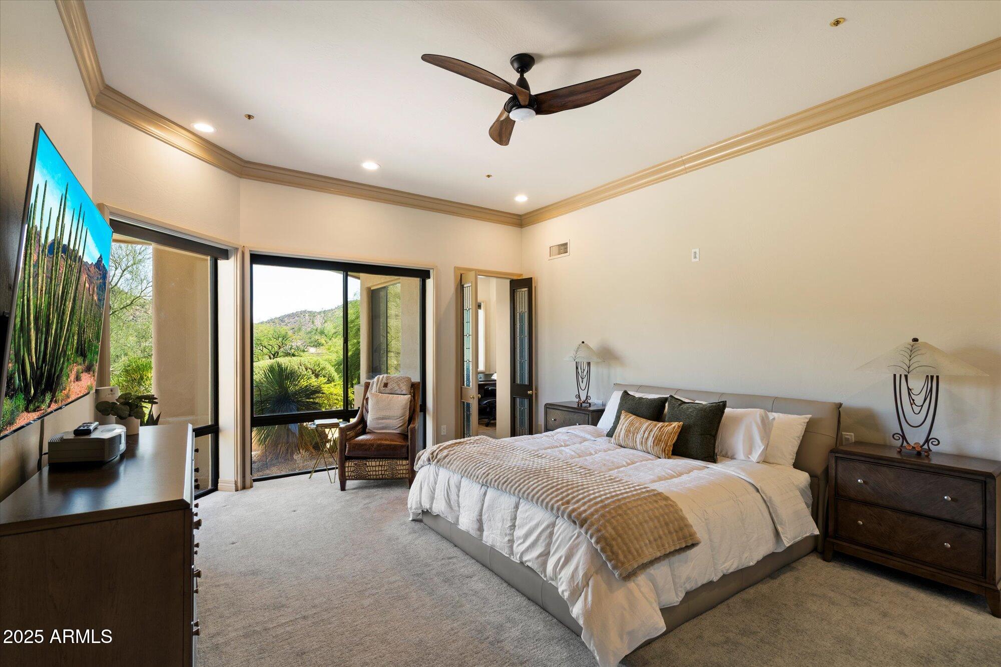 10801 East Happy Valley Road, Unit 133 Scottsdale, AZ 85255 - Photo 22 of 75 a bedroom with a large bed and a large window