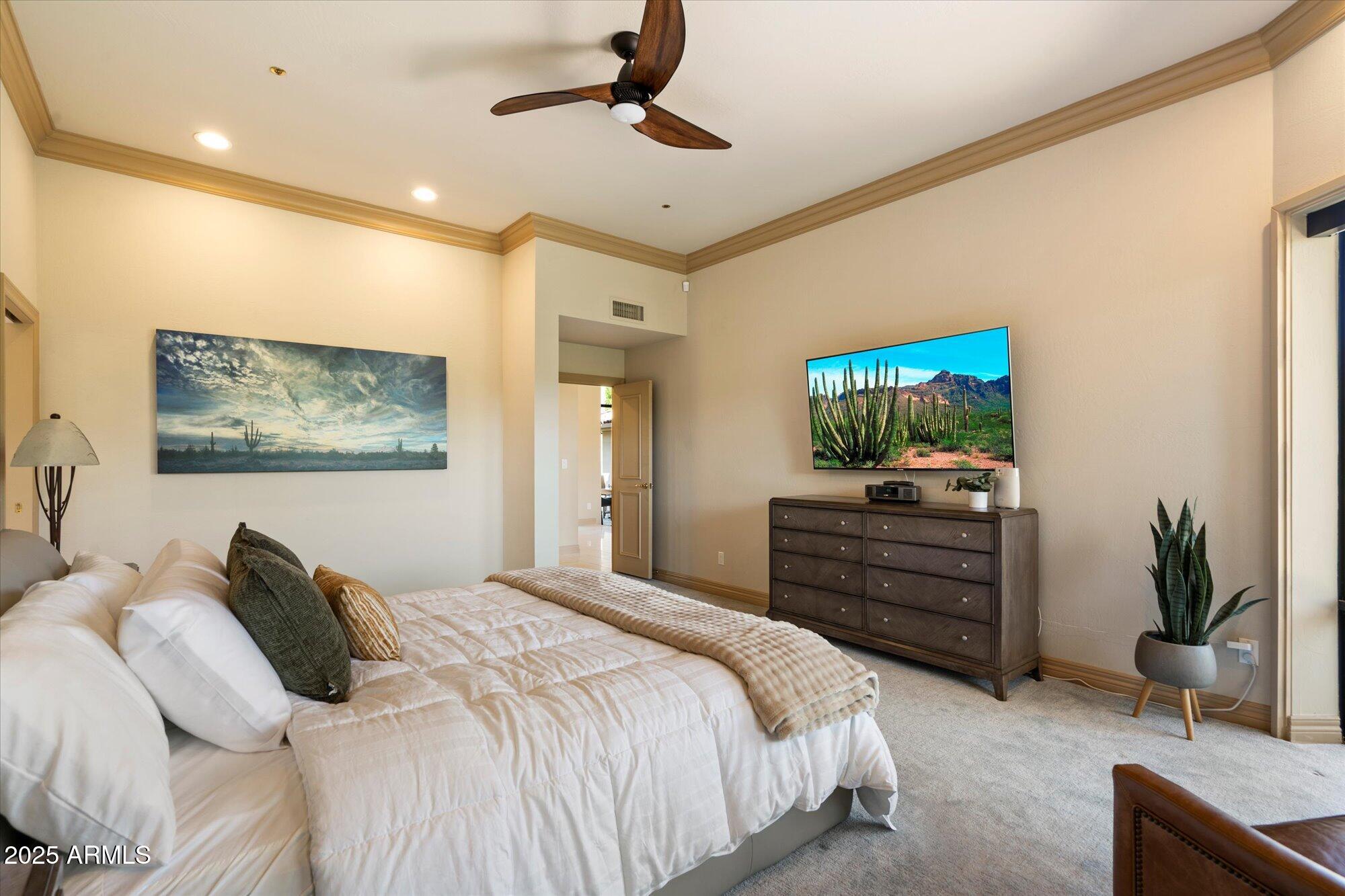 10801 East Happy Valley Road, Unit 133 Scottsdale, AZ 85255 - Photo 23 of 75 a bedroom with a bed and a flat screen tv