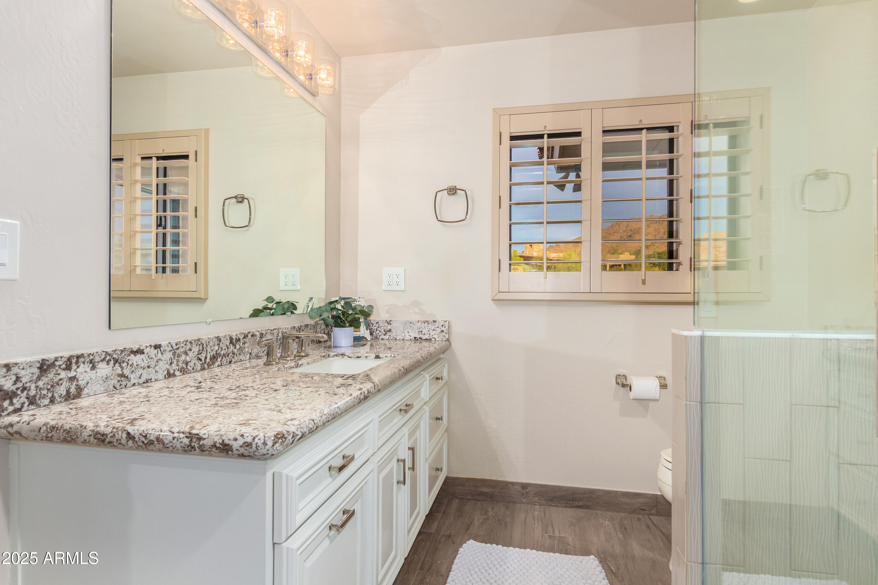 10801 East Happy Valley Road, Unit 133 Scottsdale, AZ 85255 - Photo 34 of 75 a bathroom with a granite countertop sink and a mirror