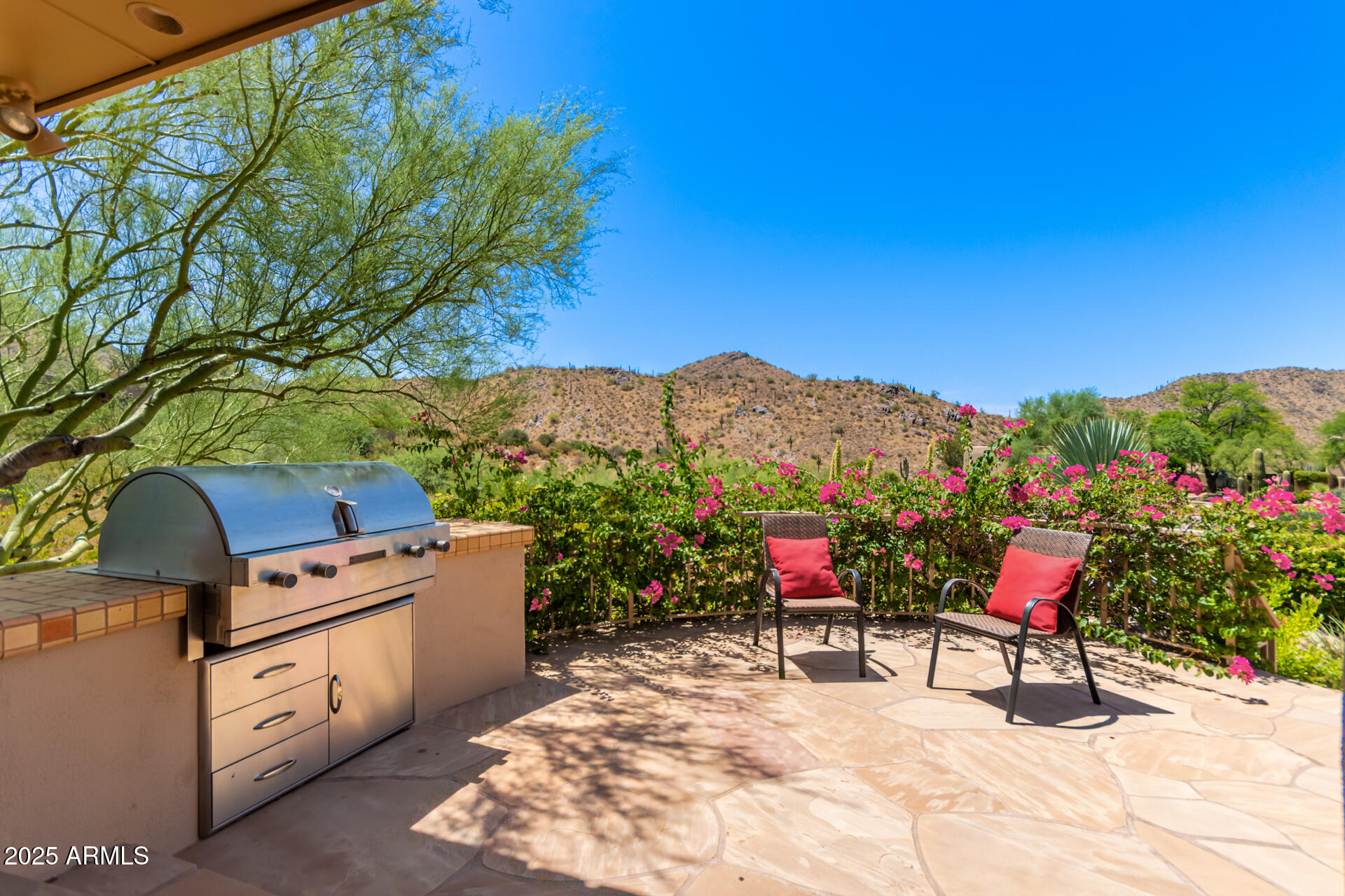 10801 East Happy Valley Road, Unit 133 Scottsdale, AZ 85255 - Photo 48 of 75 a view of a chairs and table in the backyard