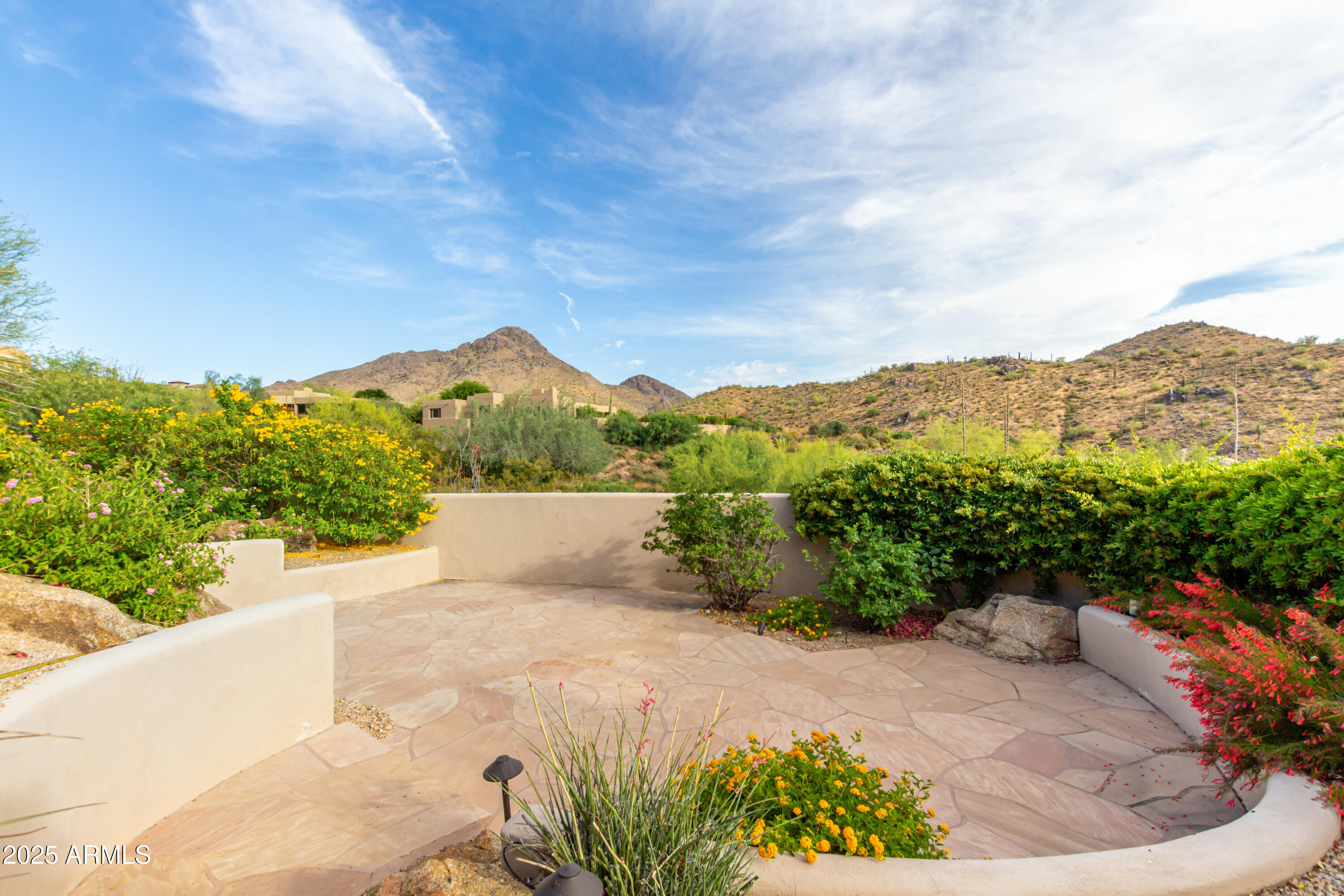 10801 East Happy Valley Road, Unit 133 Scottsdale, AZ 85255 - Photo 49 of 75 a view of a terrace with a garden and mountain view