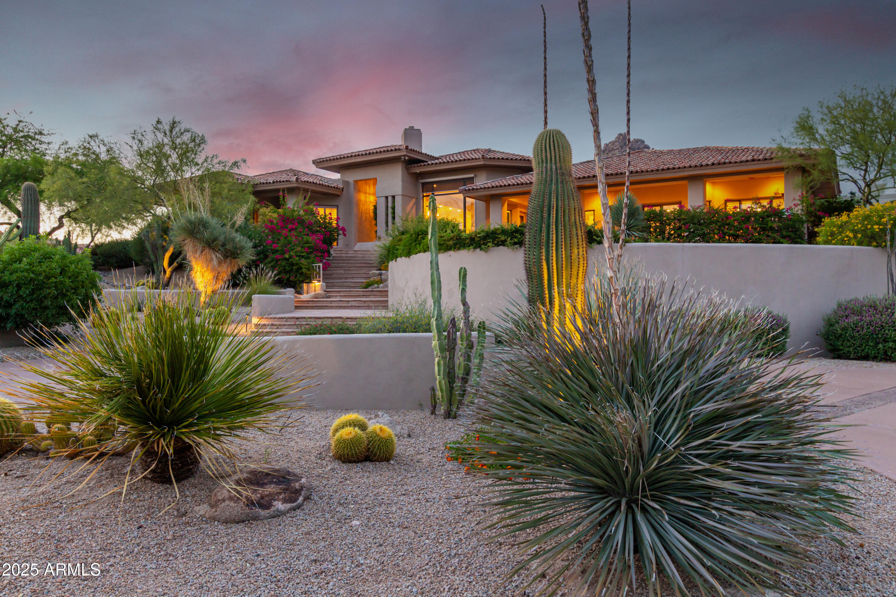 10801 East Happy Valley Road, Unit 133 Scottsdale, AZ 85255 - Photo 5 of 75 a front view of a house with yard and outdoor seating
