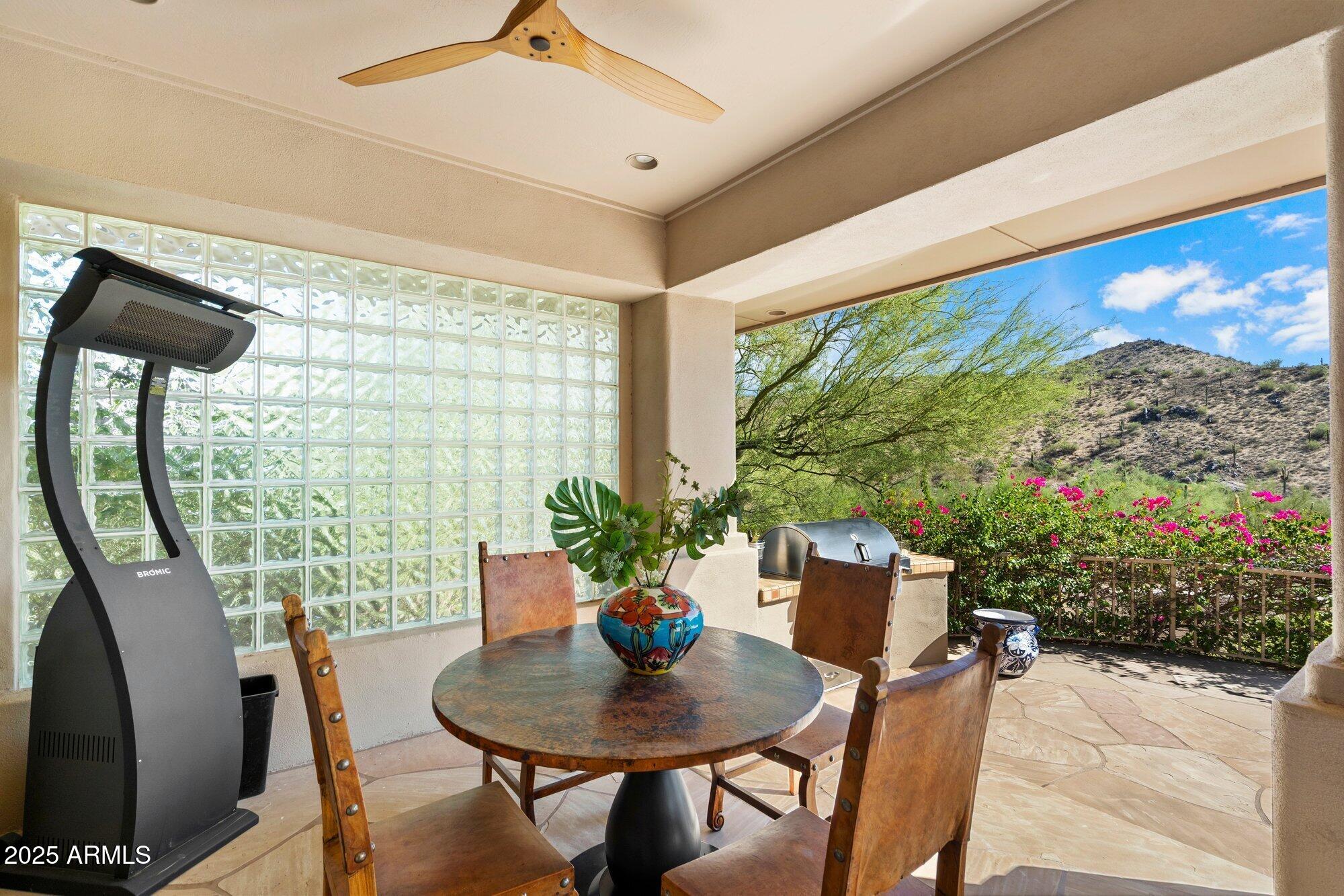 10801 East Happy Valley Road, Unit 133 Scottsdale, AZ 85255 - Photo 58 of 75 a view of a dining room with furniture window and wooden floor
