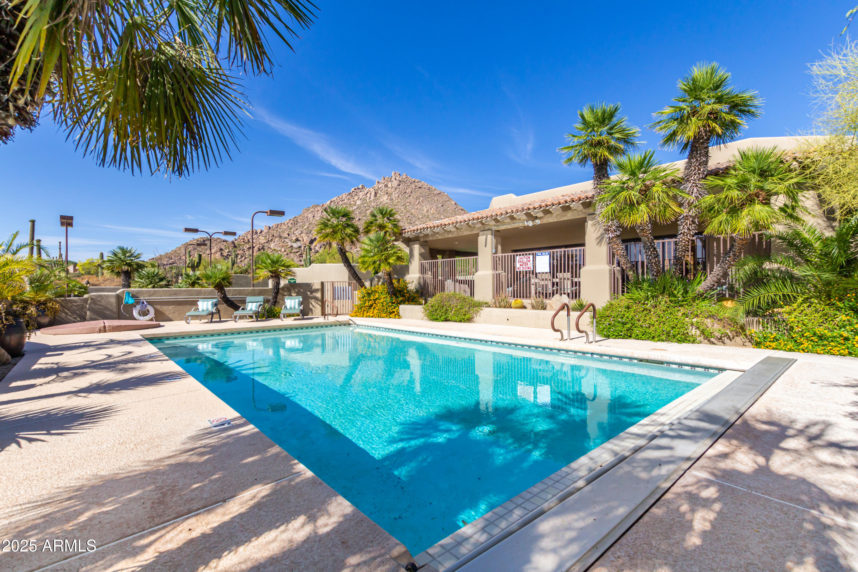 10801 East Happy Valley Road, Unit 133 Scottsdale, AZ 85255 - Photo 71 of 75 a view of a swimming pool with a garden