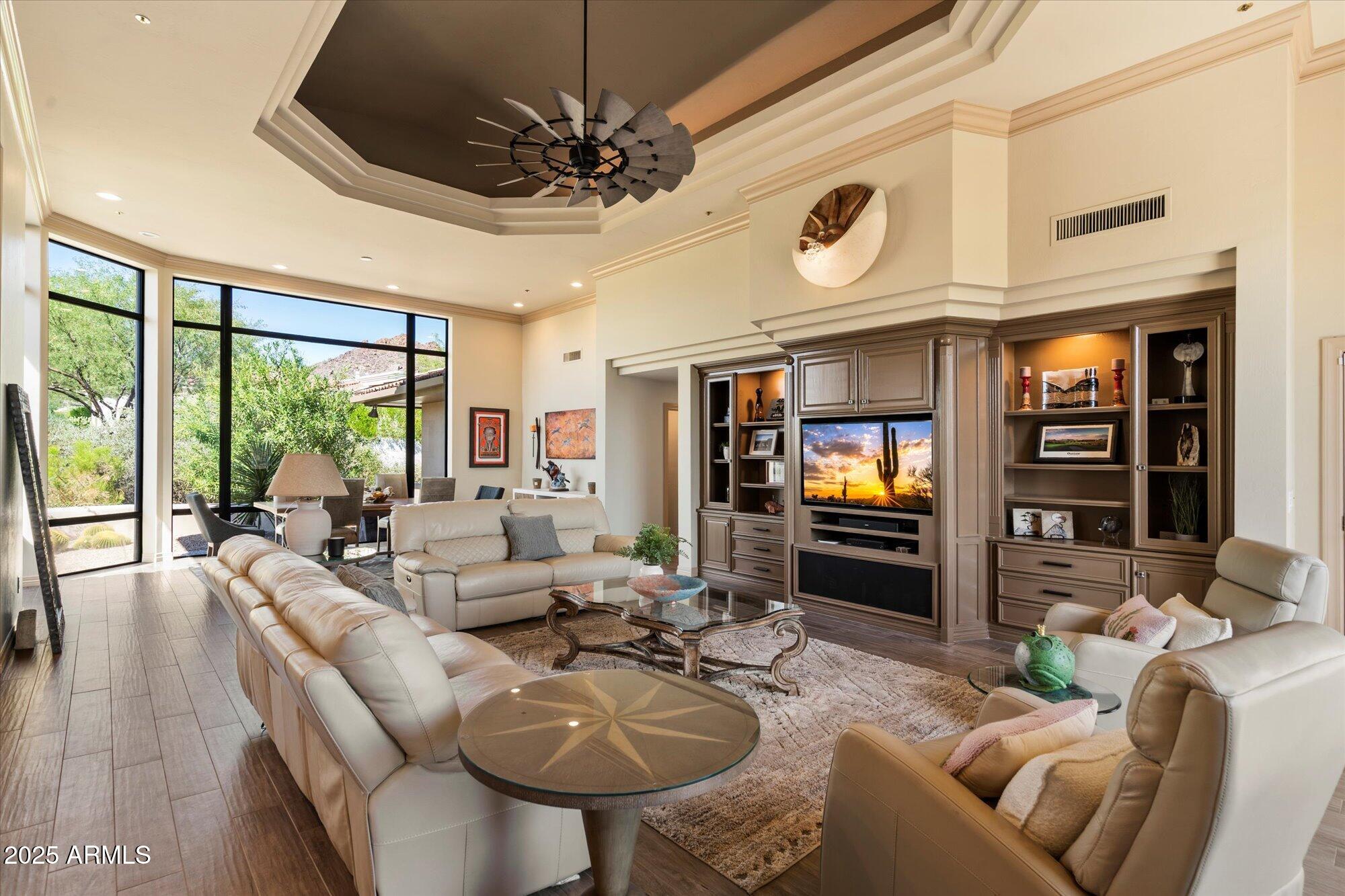 10801 East Happy Valley Road, Unit 133 Scottsdale, AZ 85255 - Photo 8 of 75 a living room with fireplace furniture and a flat screen tv
