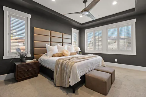 a bedroom with bed and window