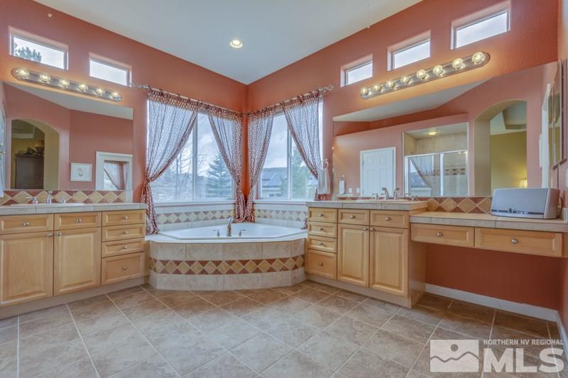 5265 North Elk River Road Reno, NV 89511 - Photo 14 of 25 a bathroom with a sink vanity and mirror