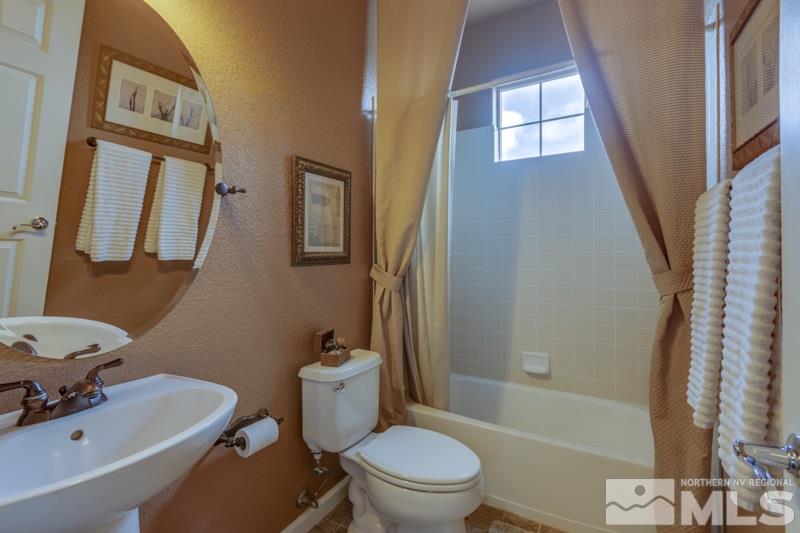 5265 North Elk River Road Reno, NV 89511 - Photo 16 of 25 a bathroom with a sink toilet and shower