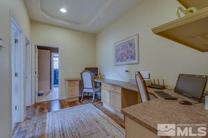 5265 North Elk River Road Reno, NV 89511 - Photo 17 of 25 a view of a workspace with furniture and wooden floor
