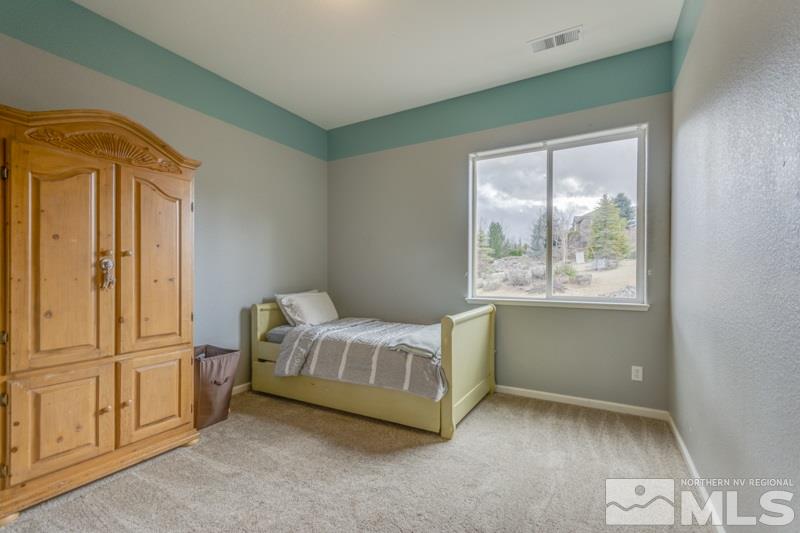5265 North Elk River Road Reno, NV 89511 - Photo 18 of 25 a room with a bed and a window