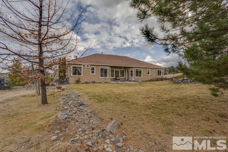 5265 North Elk River Road Reno, NV 89511 - Photo 24 of 25 a front view of a house with a yard