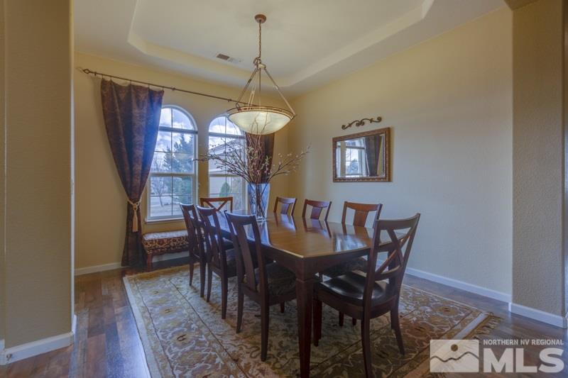 5265 North Elk River Road Reno, NV 89511 - Photo 5 of 25 a view of a dining room with furniture window and wooden floor
