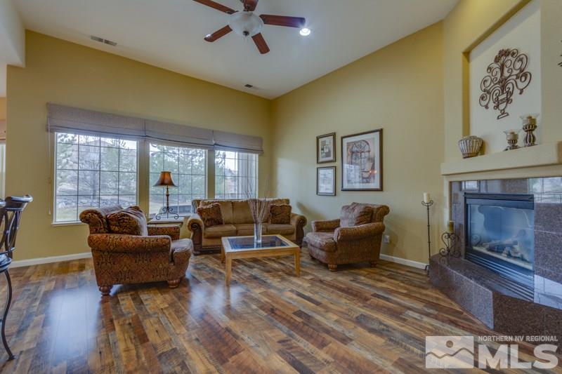 5265 North Elk River Road Reno, NV 89511 - Photo 9 of 25 a living room with furniture and a fireplace