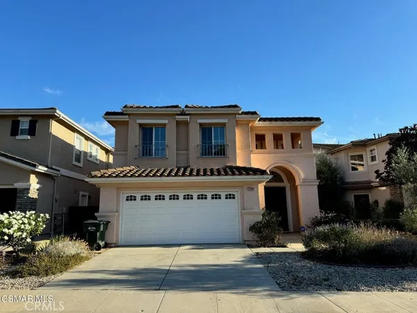 a front view of a house with yard