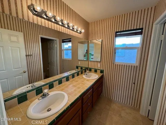 a bathroom with a tub and a shower