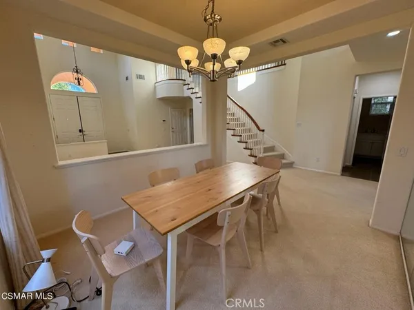 a outdoor space with a large window and chandelier