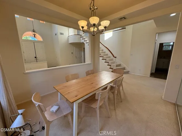 a outdoor space with a large window and chandelier