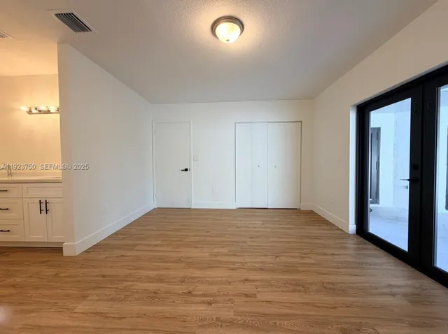 a view of an empty room and window