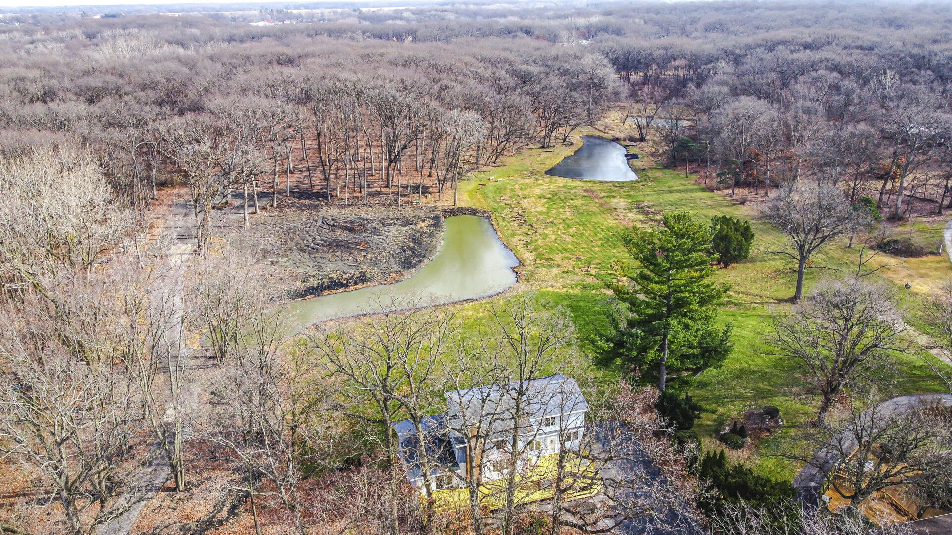 12219 Wicker Avenue Cedar Lake, IN 46303 - Photo 3 of 5 a aerial view of a house with a yard and large tree
