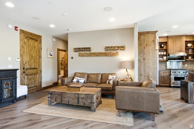 3148 Lower Saddleback Road Park City, UT 84098 - Photo 13 of 67 Open-concept living area featuring wood-finish flooring, recessed lighting, and a handcrafted wooden door