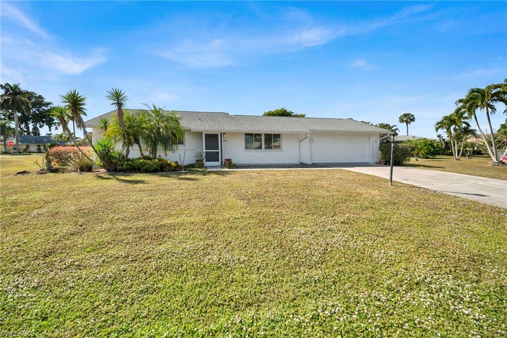 224 Potomac Place Naples, FL 34112 - Photo 2 of 17 a view of a house with a yard