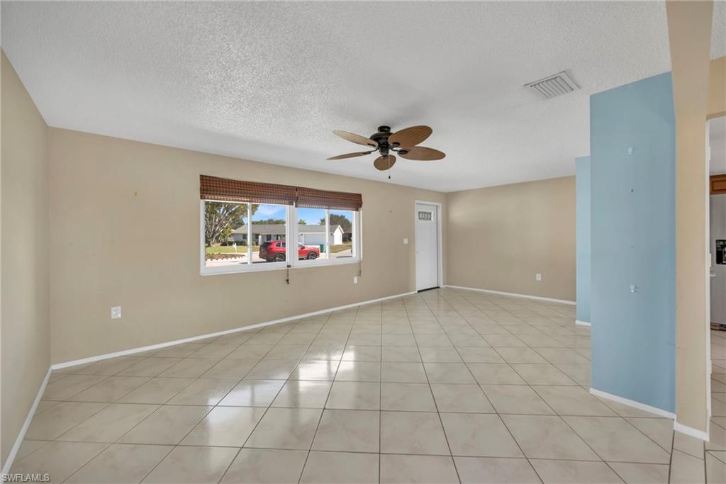 224 Potomac Place Naples, FL 34112 - Photo 4 of 17 a view of a livingroom with wooden floor and a ceiling fan