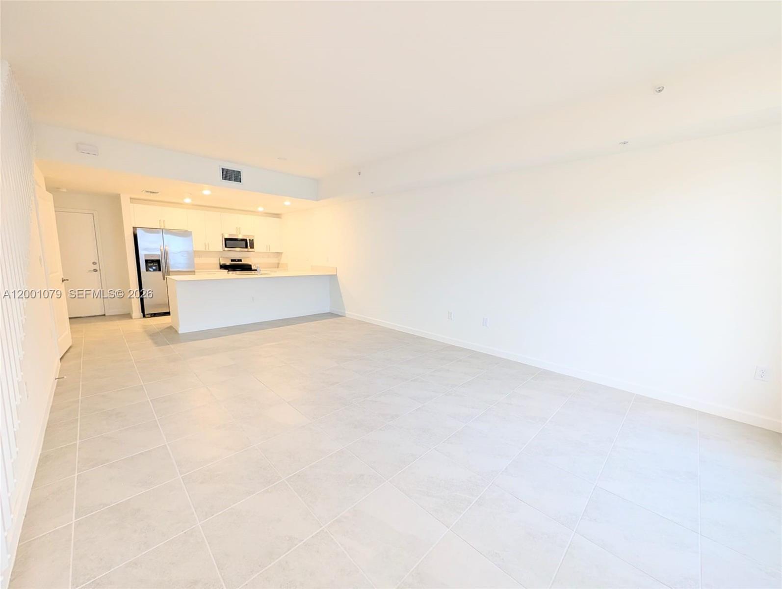 12476 Southwest 248th Street, Unit 5 Homestead, FL 33032 - Photo 3 of 10 a view of empty room