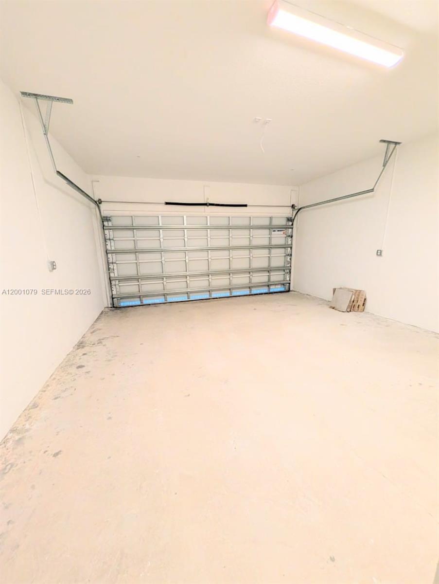 12476 Southwest 248th Street, Unit 5 Homestead, FL 33032 - Photo 10 of 10 a view of a garage