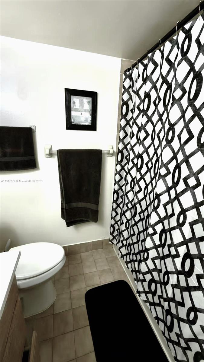 2075 Southwest 122nd Avenue, Unit 429 Miami, FL 33175 - Photo 4 of 10 a bathroom with a toilet and a shower