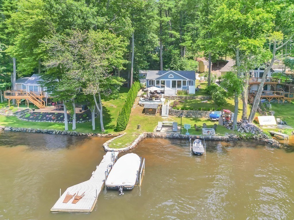 40 Over The Top Road Holland, MA 01521 - Photo 1 of 41 an aerial view of a swimming pool with outdoor seating and lake view