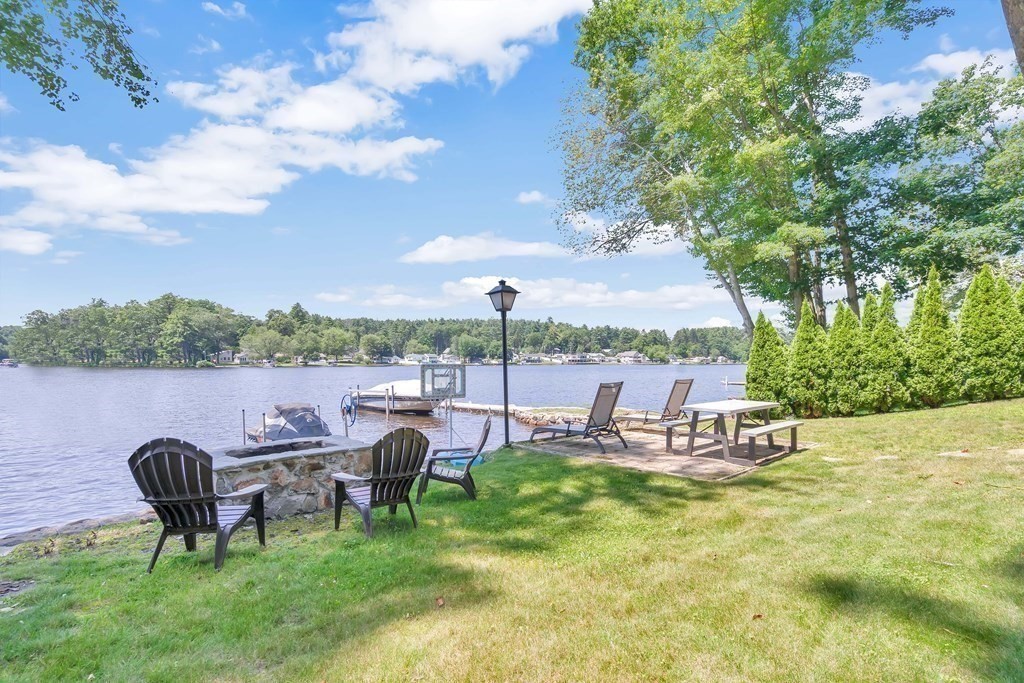 40 Over The Top Road Holland, MA 01521 - Photo 25 of 41 an outdoor sitting area with couch and a fountain