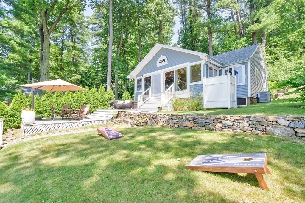 40 Over The Top Road Holland, MA 01521 - Photo 29 of 41 a front view of a house with a yard table and chairs